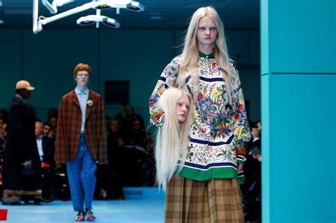 why did gucci models carry fake heads|Milan Fashion Week: Models carry fake .